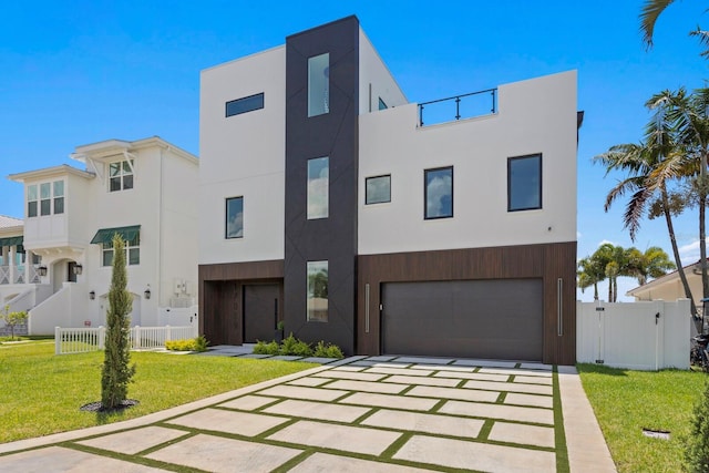 modern home featuring a garage and a front yard