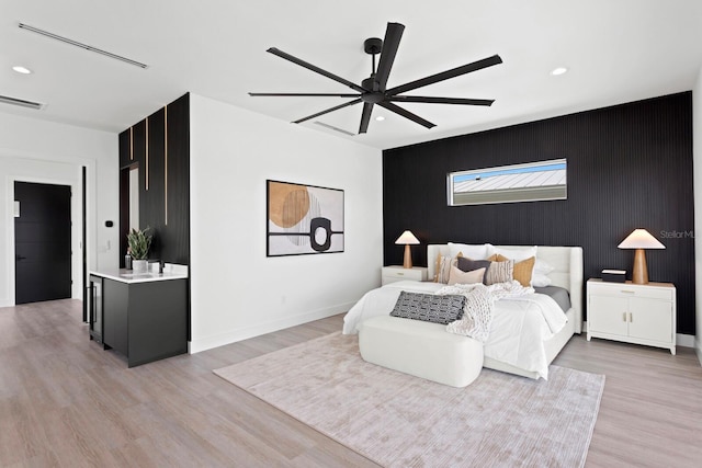 bedroom featuring ceiling fan and light hardwood / wood-style floors