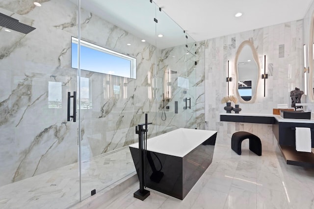 bathroom featuring vanity and separate shower and tub