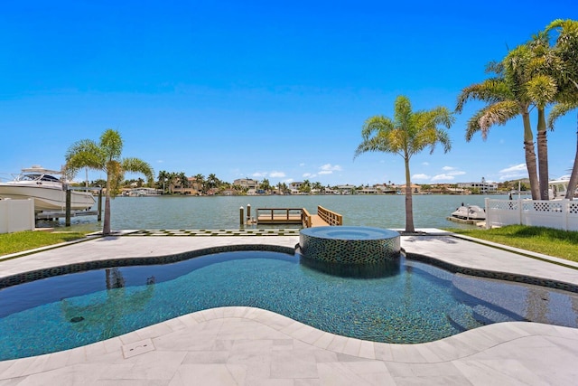 view of swimming pool featuring an in ground hot tub, a water view, and a dock