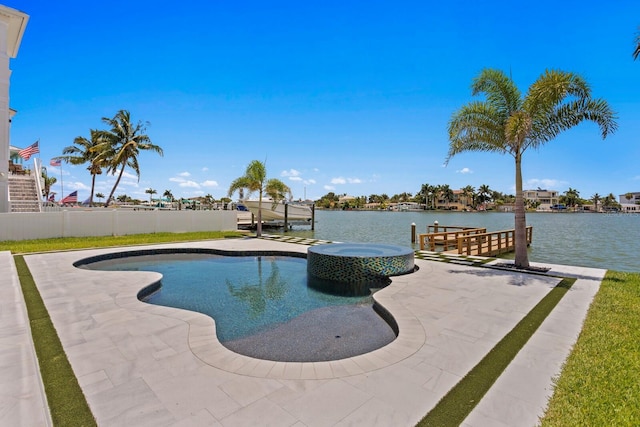 view of pool with a water view