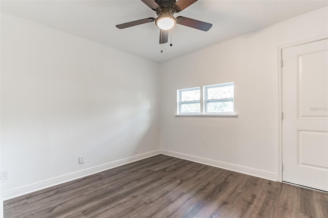 empty room featuring dark wood-type flooring and ceiling fan