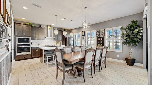 dining area featuring a notable chandelier