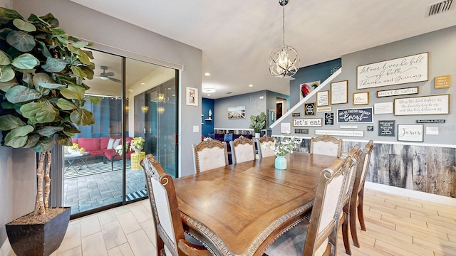 dining space featuring an inviting chandelier