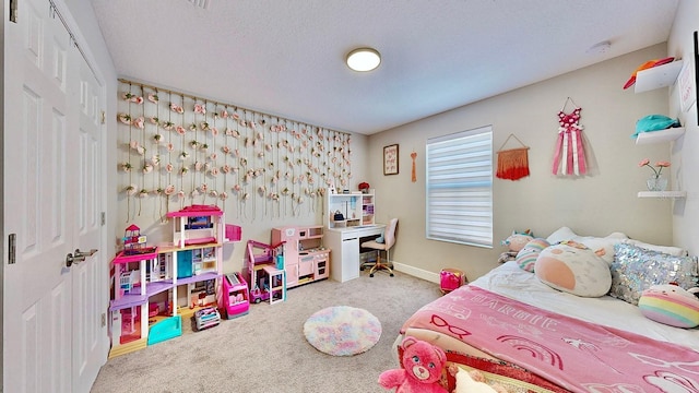 bedroom featuring light carpet and a textured ceiling