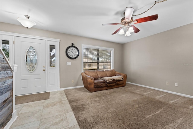 foyer entrance with ceiling fan