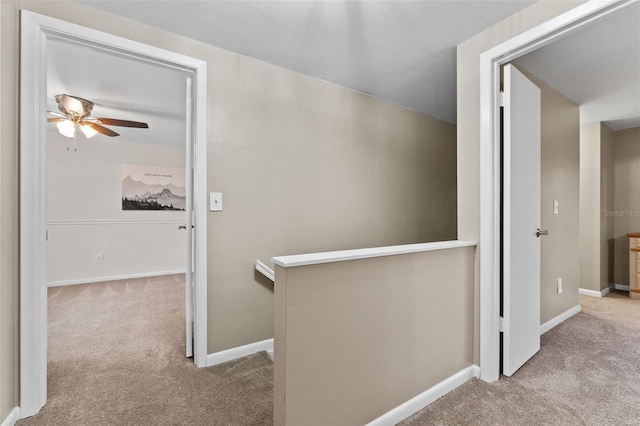 hallway with light colored carpet