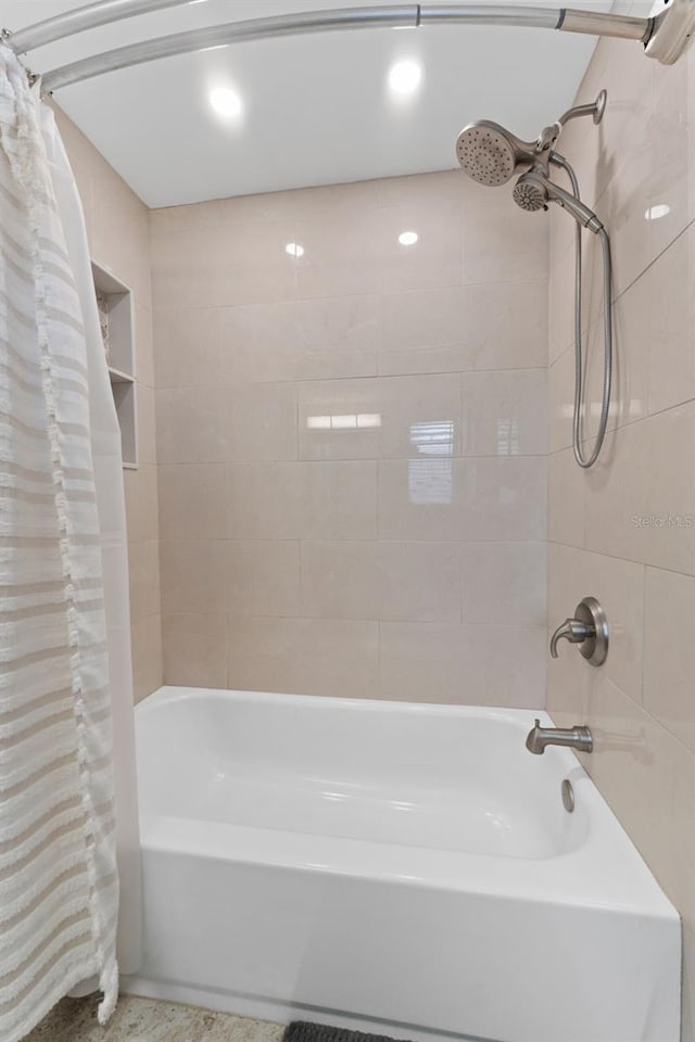 bathroom with shower / bathtub combination with curtain