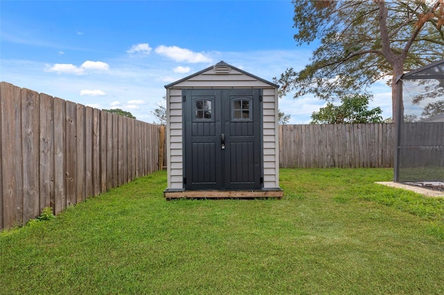 view of outdoor structure with a lawn