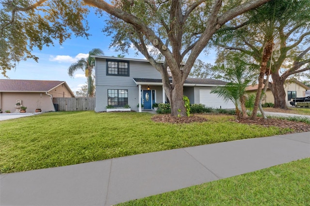 view of front of property featuring a garage and a front lawn