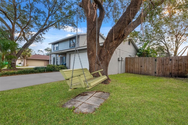 view of front of house featuring a garage and a front yard