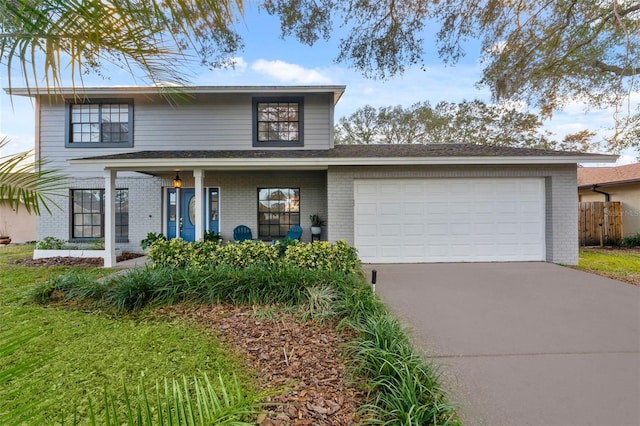 front of property with covered porch and a garage