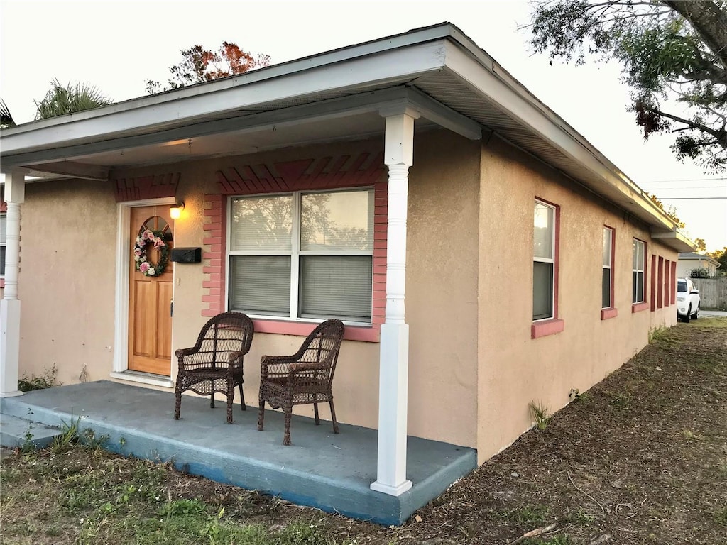 view of property exterior with a porch