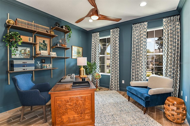 office space with ceiling fan and crown molding