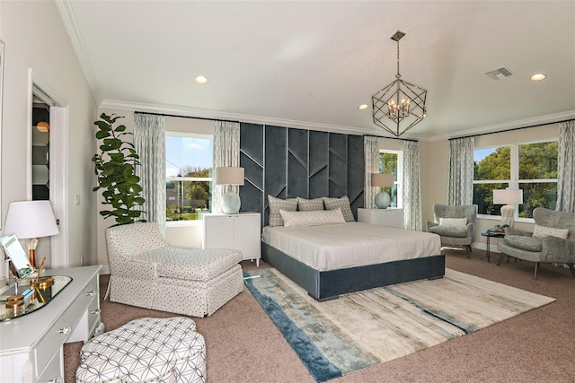 carpeted bedroom featuring a notable chandelier and ornamental molding