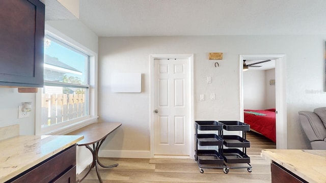 office space with light hardwood / wood-style flooring and ceiling fan