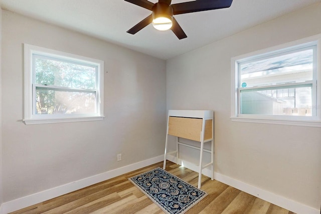 interior space with hardwood / wood-style floors and ceiling fan