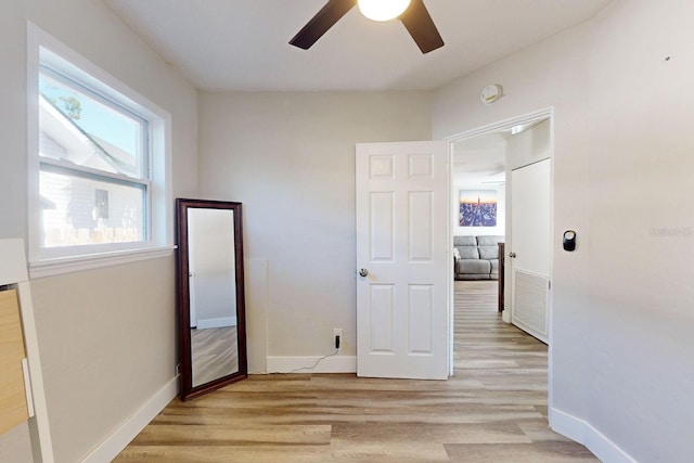 unfurnished bedroom featuring light hardwood / wood-style flooring and ceiling fan