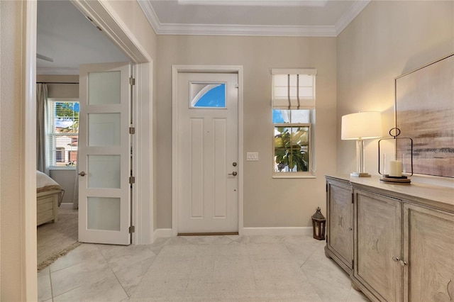 foyer featuring crown molding