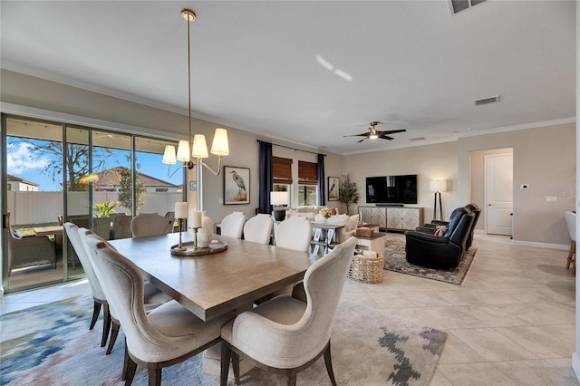 dining room featuring light tile patterned floors, ceiling fan with notable chandelier, and crown molding