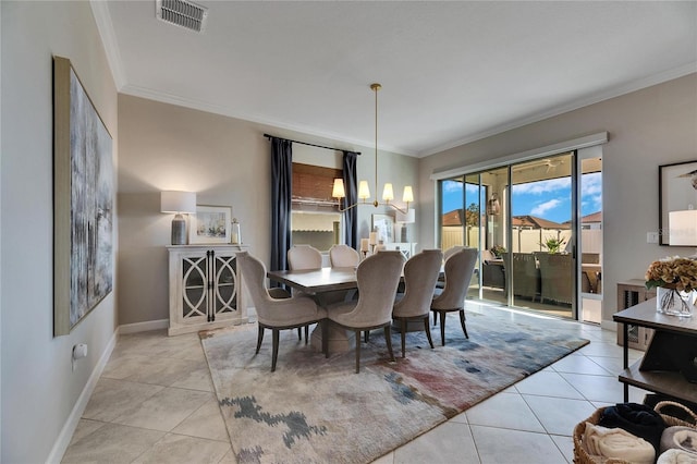 tiled dining space featuring ornamental molding