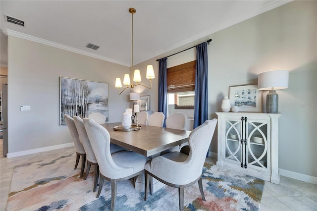 tiled dining area with crown molding and a chandelier