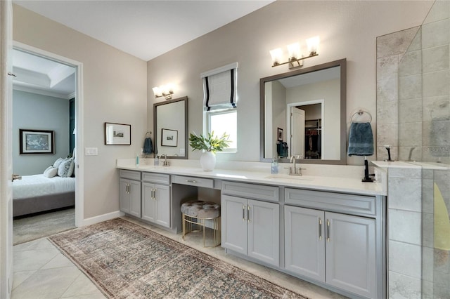 bathroom featuring tile patterned flooring and vanity