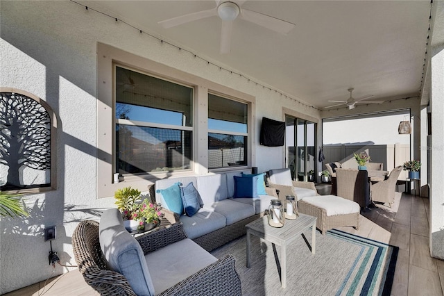 view of patio featuring outdoor lounge area and ceiling fan