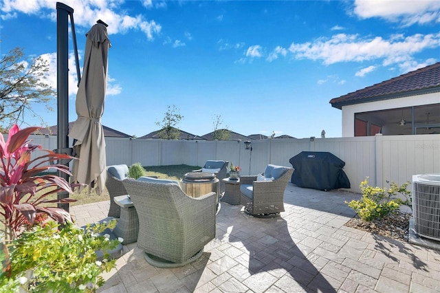 view of patio / terrace with a grill and central air condition unit