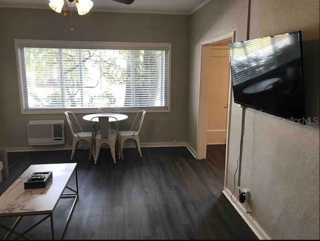 dining area with an AC wall unit, ceiling fan, and dark wood-type flooring