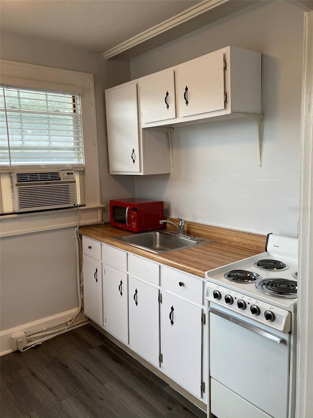 kitchen with sink, white electric range oven, dark hardwood / wood-style flooring, cooling unit, and white cabinets