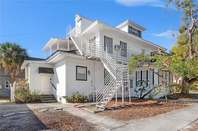 view of front of house featuring stairway