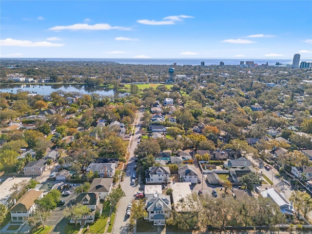 birds eye view of property with a water view and a residential view