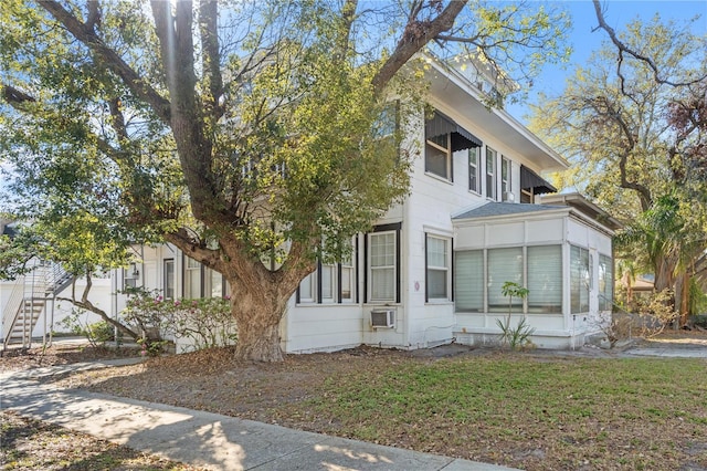 view of front of home featuring a sunroom