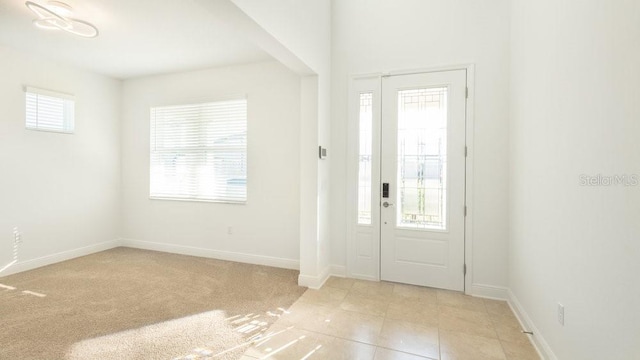 foyer featuring plenty of natural light