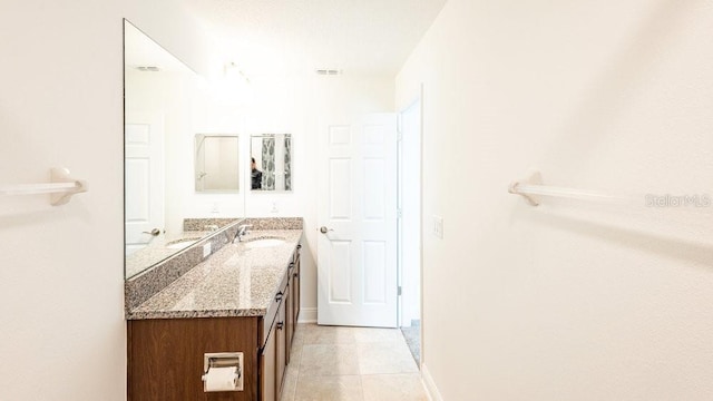 bathroom featuring tile patterned floors and vanity