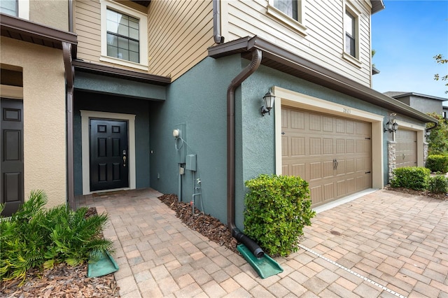 doorway to property featuring a garage