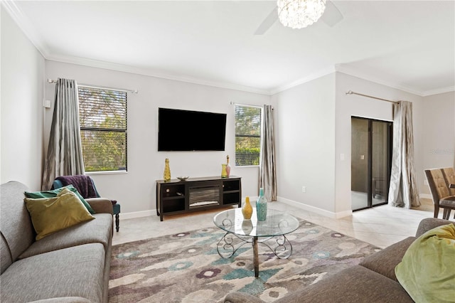 living room with ceiling fan, plenty of natural light, light tile patterned floors, and ornamental molding