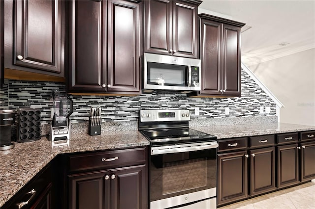 kitchen with backsplash, dark stone countertops, crown molding, dark brown cabinets, and appliances with stainless steel finishes