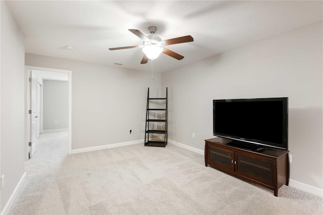 carpeted living room featuring ceiling fan