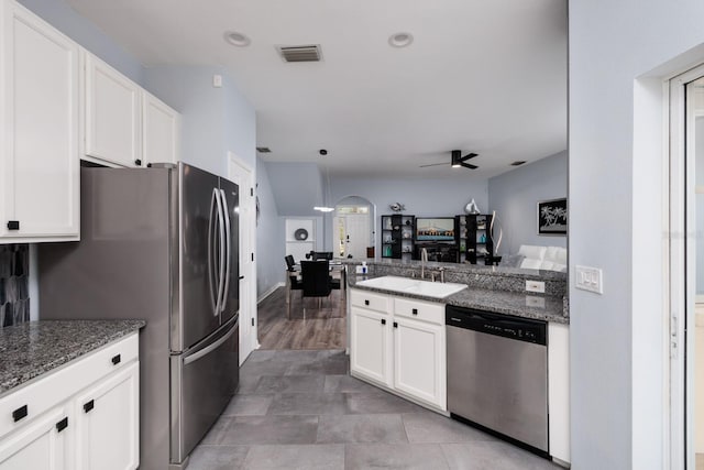 kitchen featuring white cabinetry, sink, ceiling fan, and stainless steel appliances