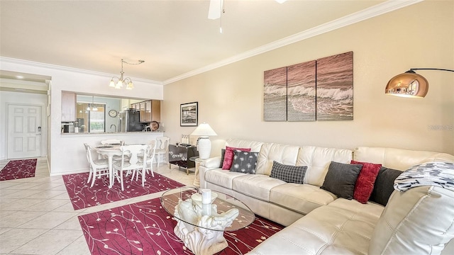 living room with ornamental molding, light tile patterned flooring, a chandelier, and sink