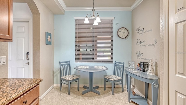 dining area with an inviting chandelier, light tile patterned floors, and crown molding