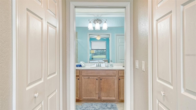 bathroom with vanity, tile patterned flooring, and ceiling fan