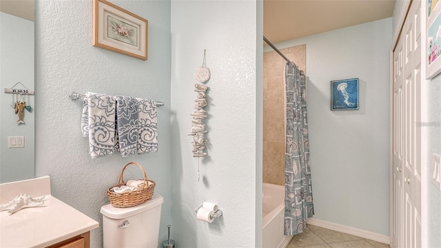 full bathroom with toilet, tile patterned flooring, shower / bath combo with shower curtain, and vanity