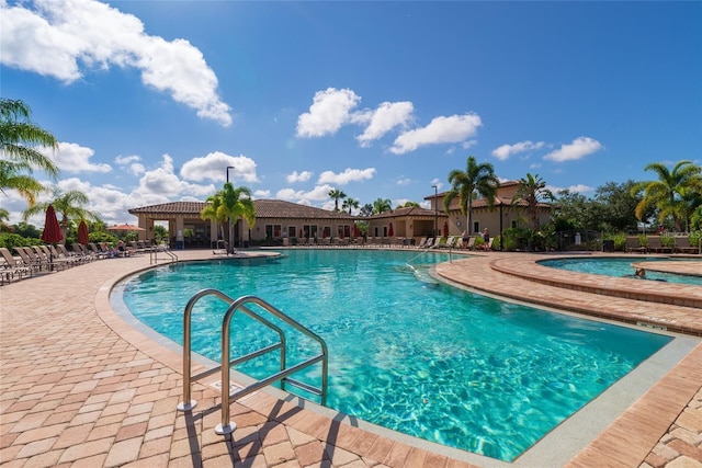 view of swimming pool featuring a patio area