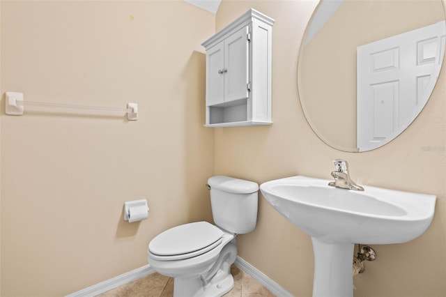 bathroom featuring tile patterned flooring and toilet