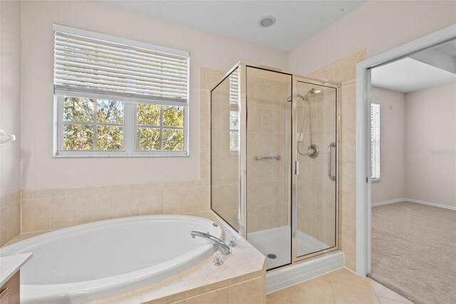 bathroom featuring tile patterned floors, separate shower and tub, and plenty of natural light