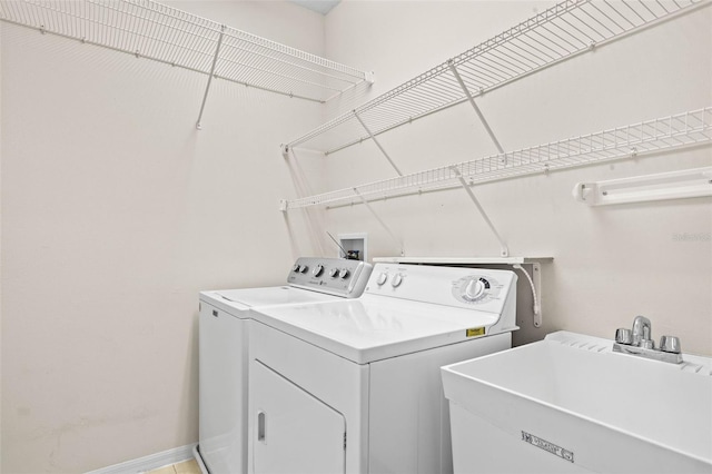 laundry room with sink and washer and dryer