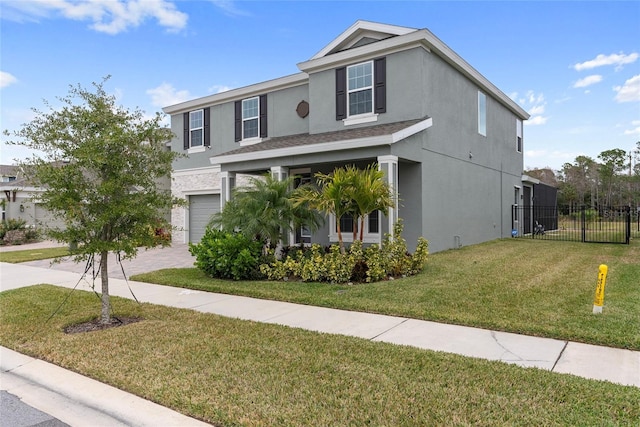 view of front of home with a front yard and a garage